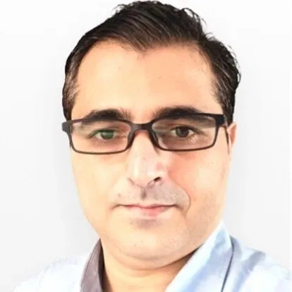 Man with glasses and short dark hair