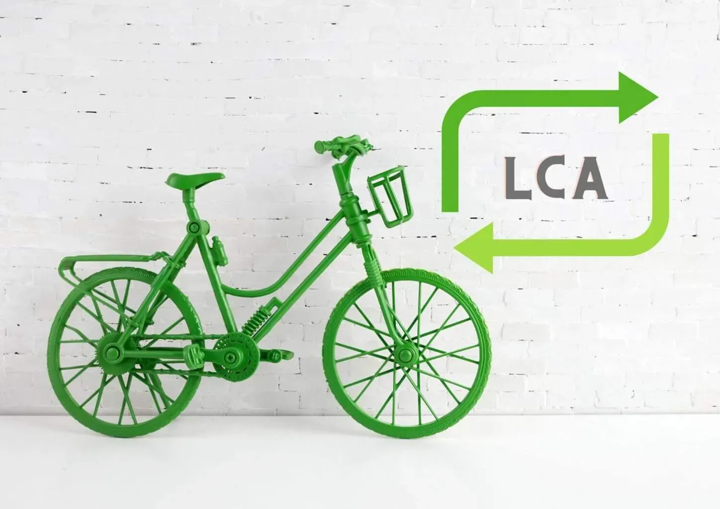 Green bicycle with LCA recycling symbol