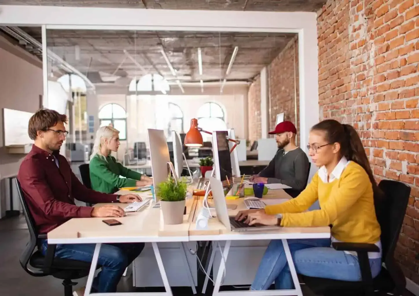 People working in a modern office setting.