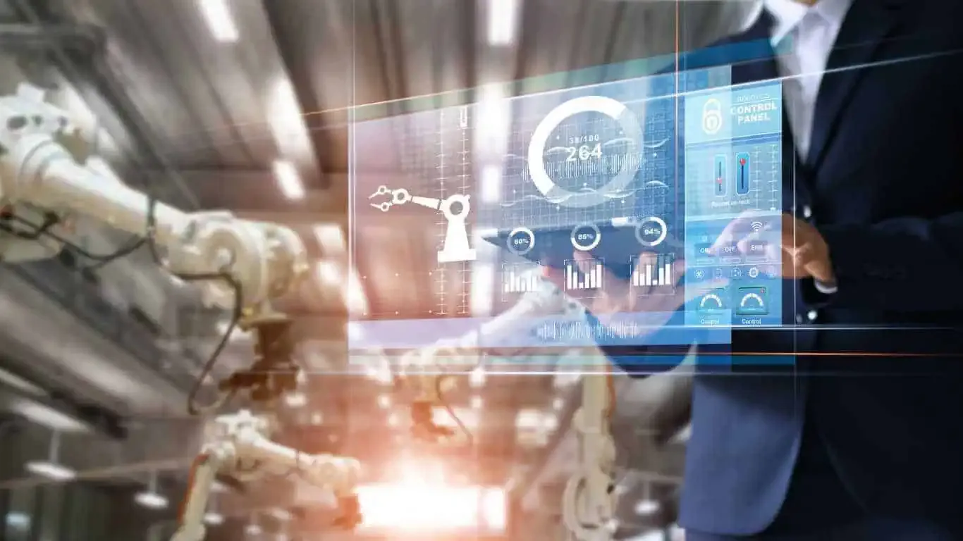 Robotics control panel with robotic arms in factory.